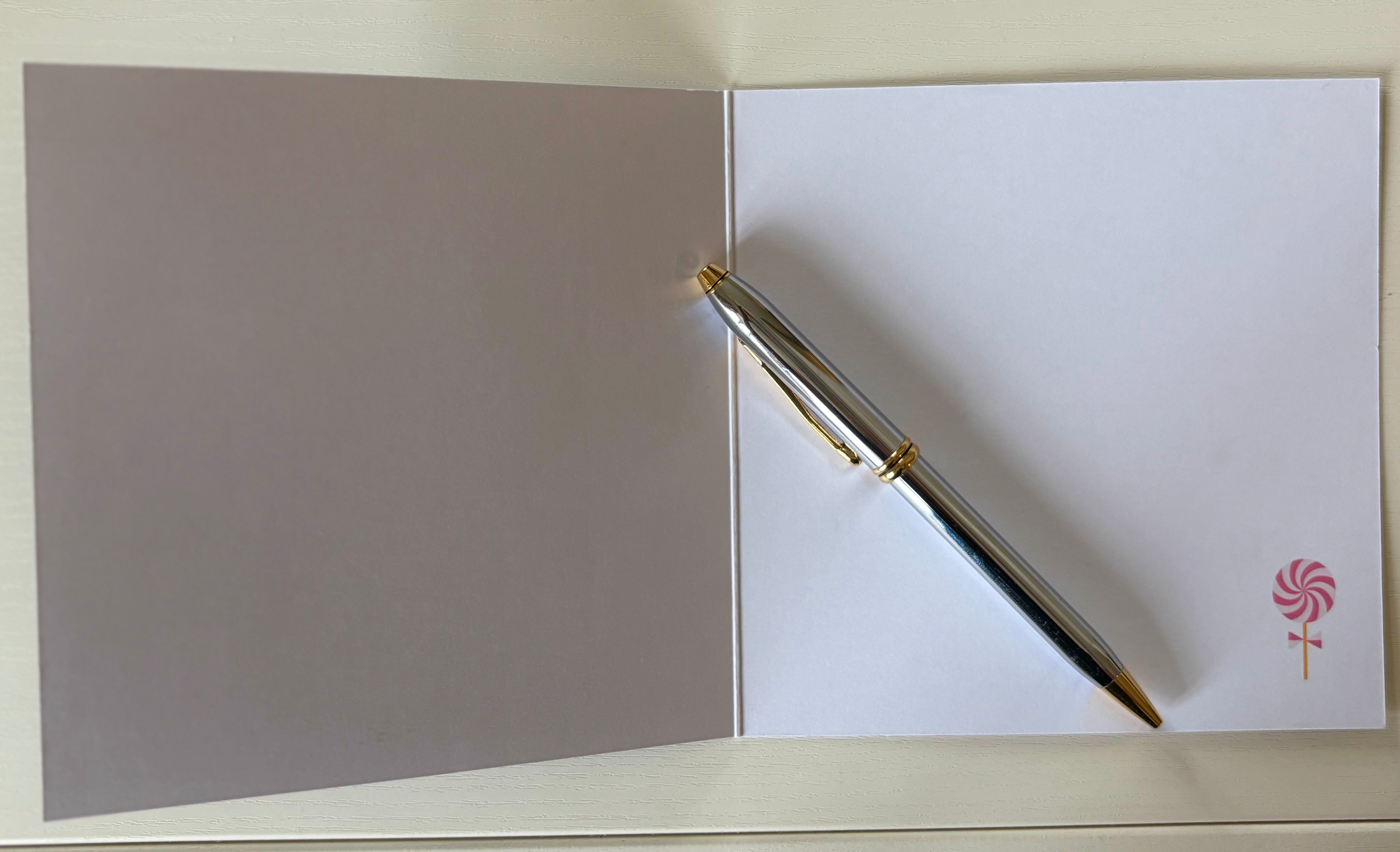 Inside view of The Nutcracker Christmas card: pink and white lollipop